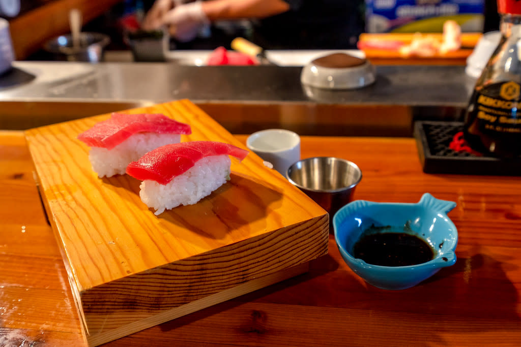 Nigiri on a wooden plate on a table