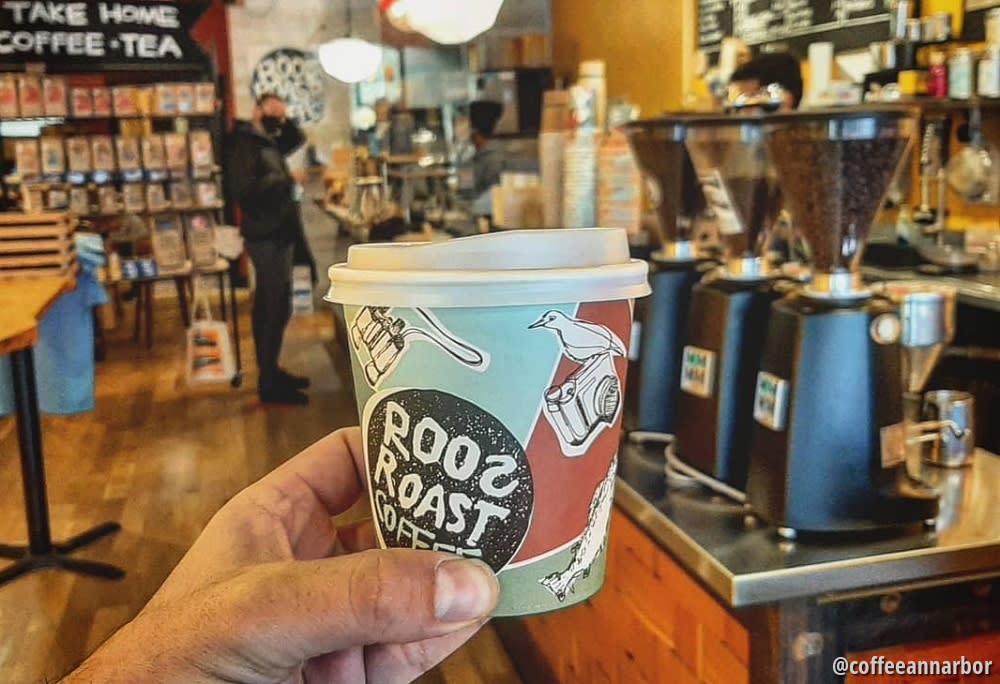 RoosRoast, person holding coffee indoors