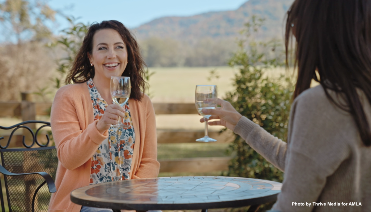 Two women enjoying a drink on the North Alabama Wine Trail.