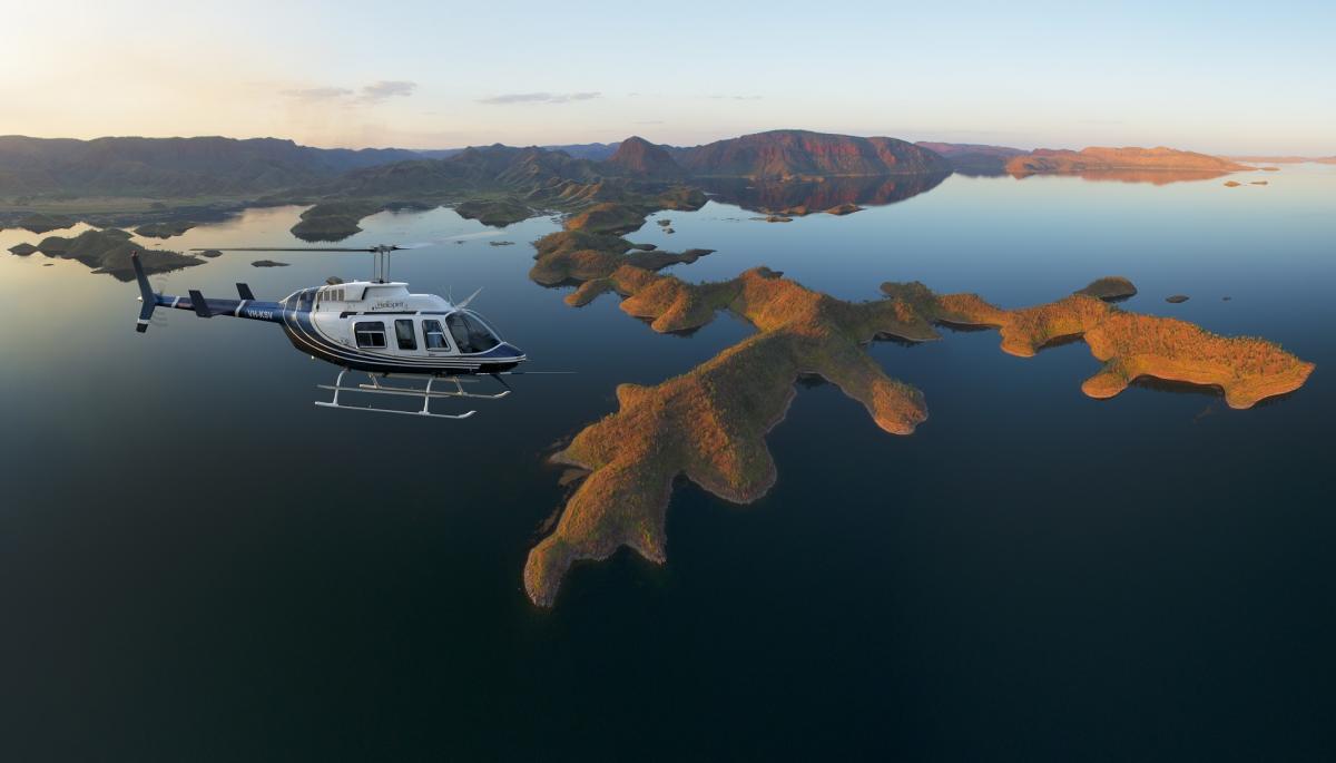 Flying over Lake Argyle on a luxury helisafari, view of HeliSpirit JetRanger from the air