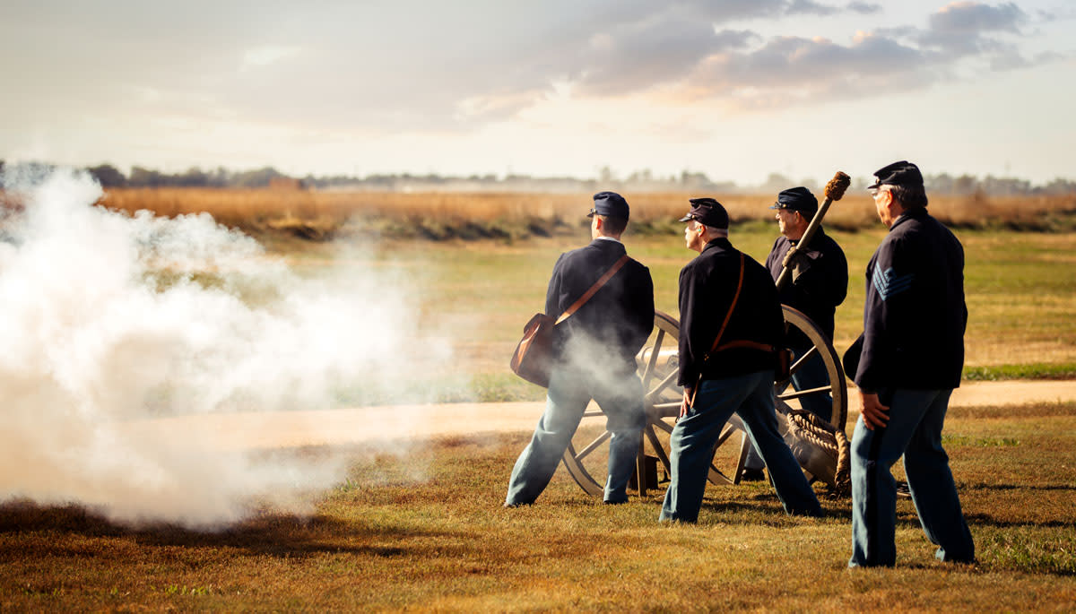 civil war reenactors fire a canon