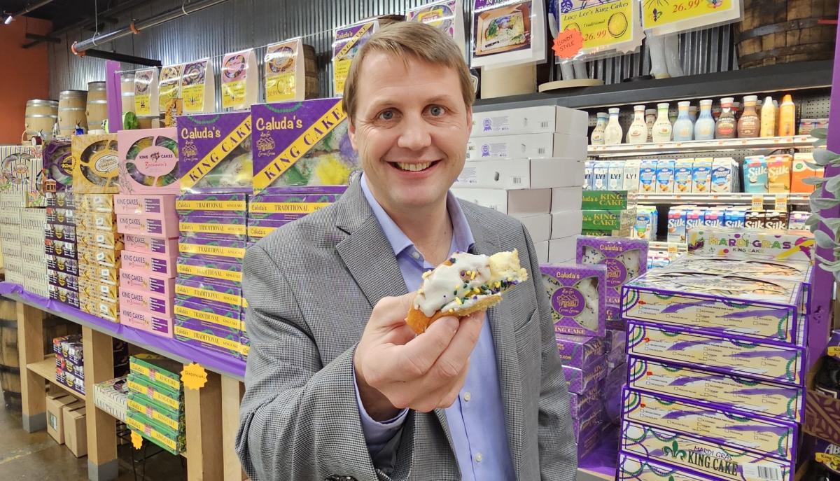 Adam Acquistapace with selection of king cakes at Acquistapace's in Covington