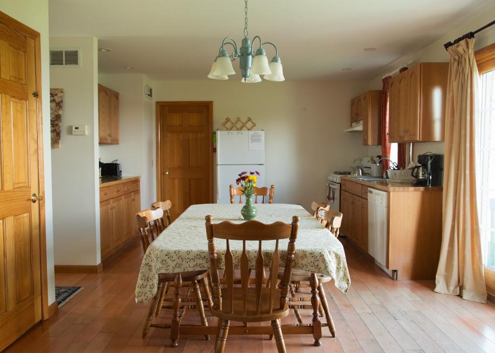 Photo of the table inside of the dining and kitchen area in the Cayuga Cottage