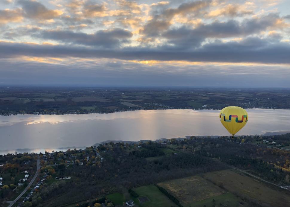 Scenic view of balloons over the lake