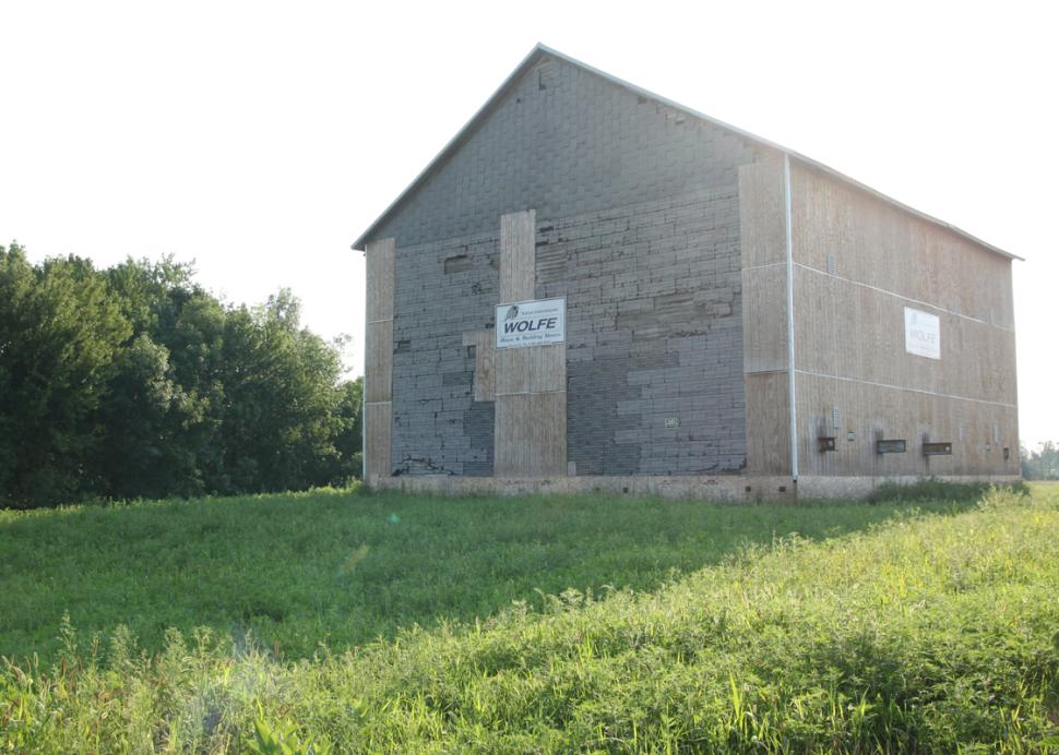 Exterior Of Quaker Meeting Building With Sunlight Shining Behind It In the Morning