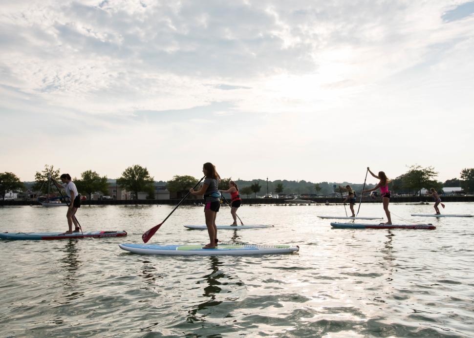 Customers participate in stand up Paddle boarding on Canandaigua Lake
