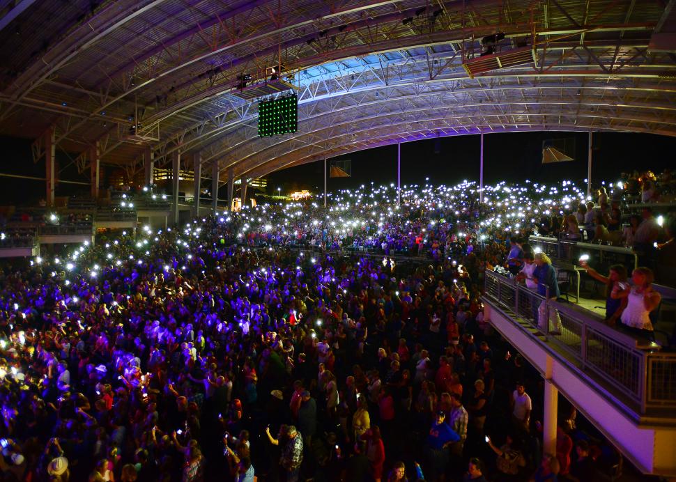 Photo of a crowd of people at a concert in the CMAC Center in Canandaigua