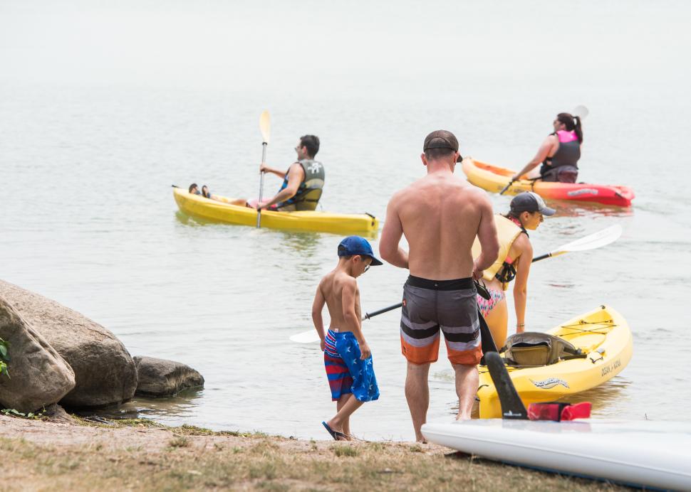 A family launches their kayaks at Kershaw Park in Canandaigua