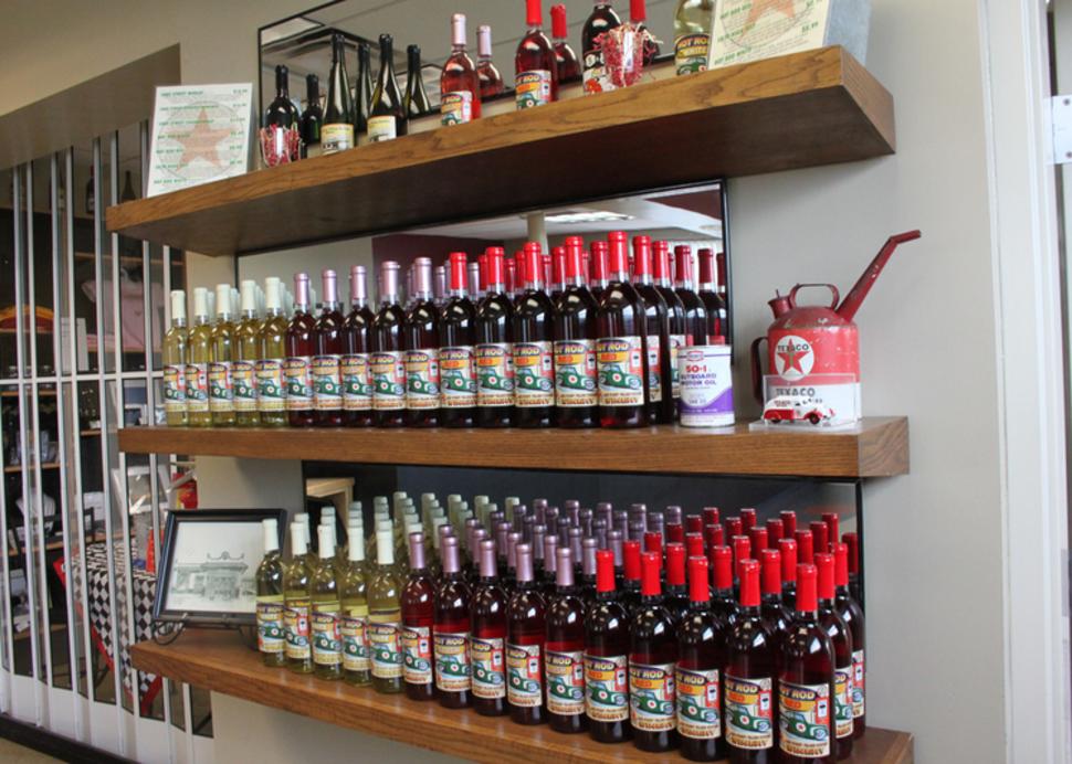 Photo of wine bottles on a shelf at Lake Street Station Winery in Geneva