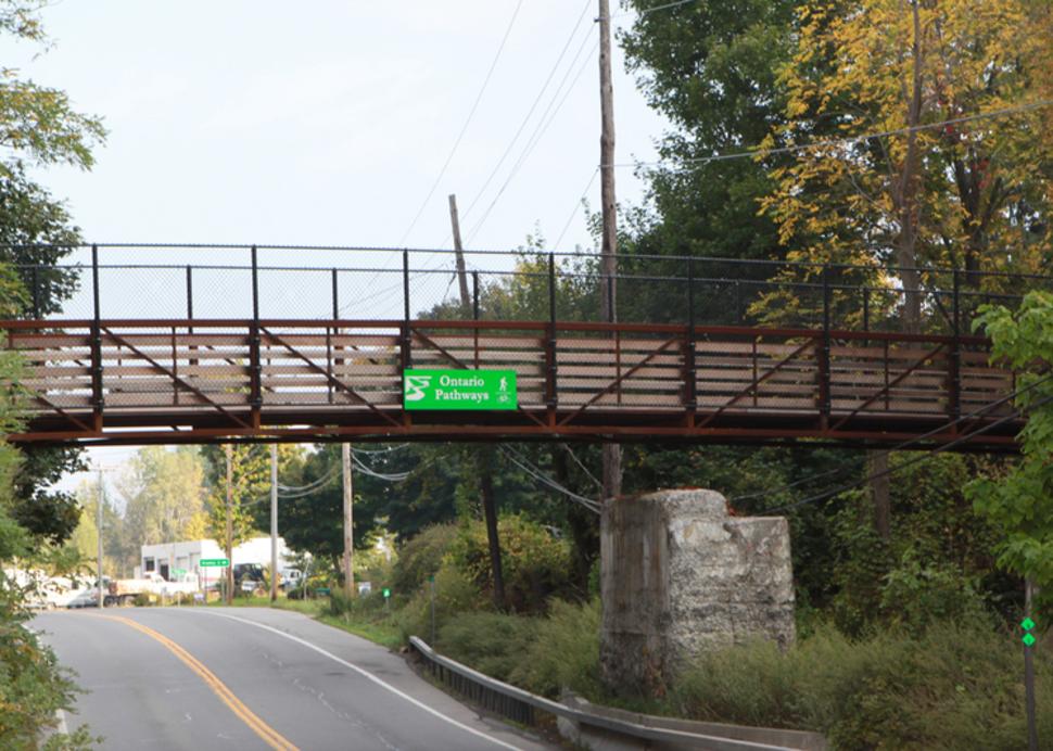 A bridge connects a trail for the ontario pathways