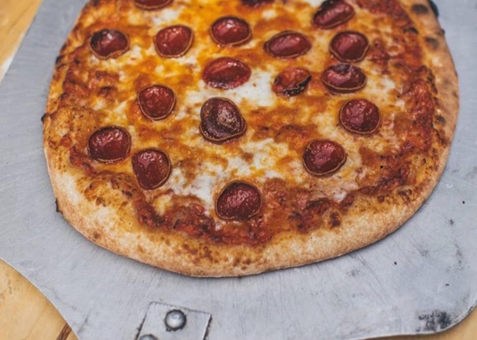 Photo of a pizza freshly baked at Heron Hill tasting center in Canandaigua