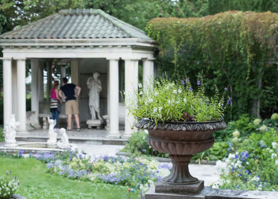 A man walks through the gardens at Sonnenberg Mansion in Canandaigua