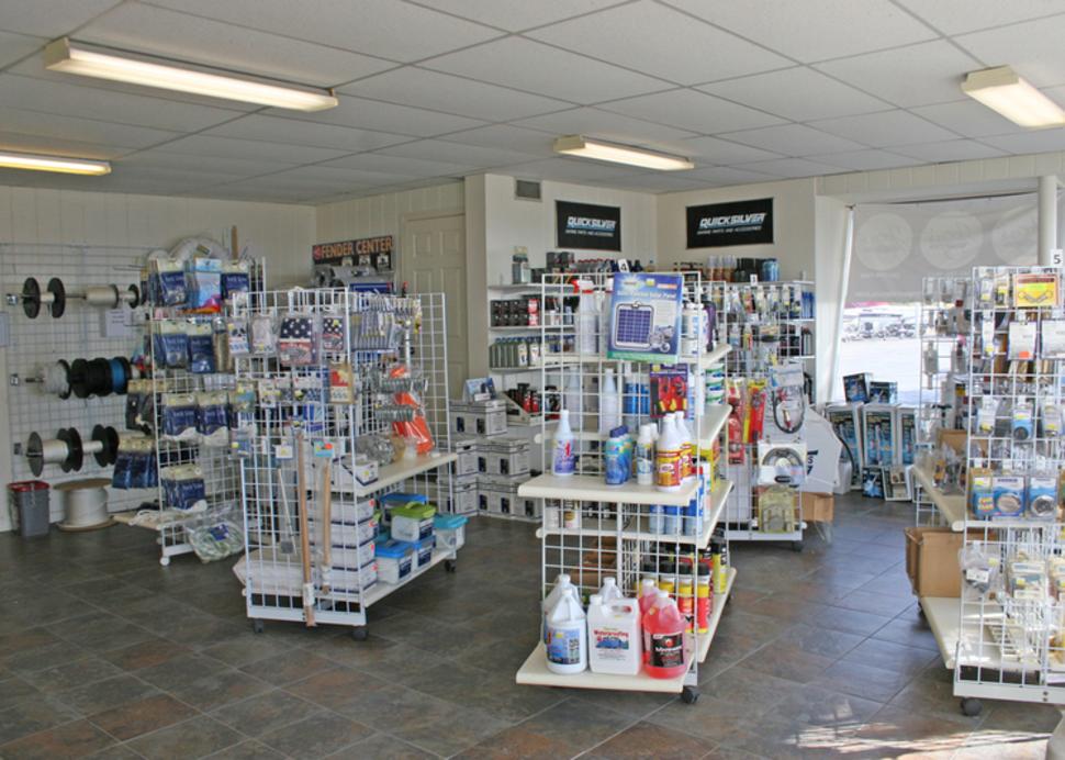 Shelves full of different items for sale inside of Sutters Marina in Canandaigua