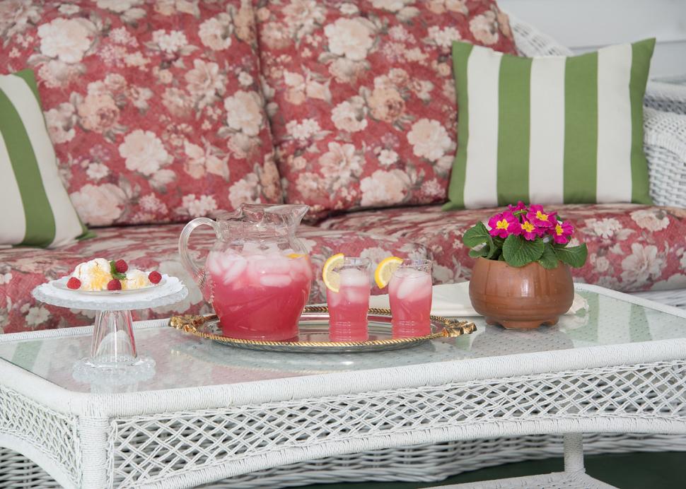 Wicker seating on the outdoor porch of the Inn On The Main