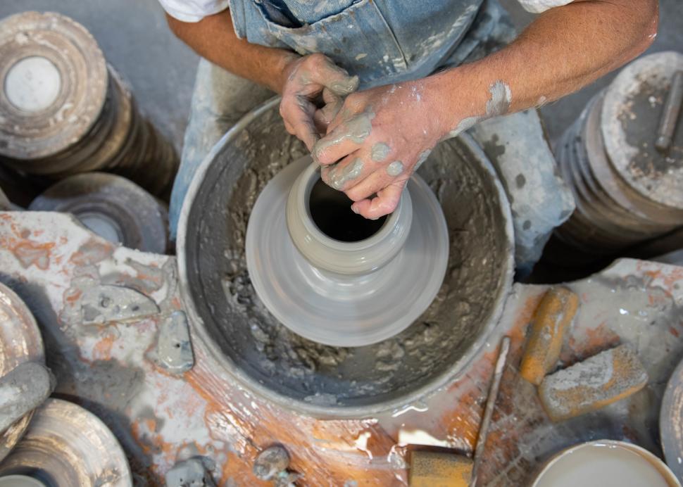 A man spins pottery at the Wizard of Clay in Bloomfield