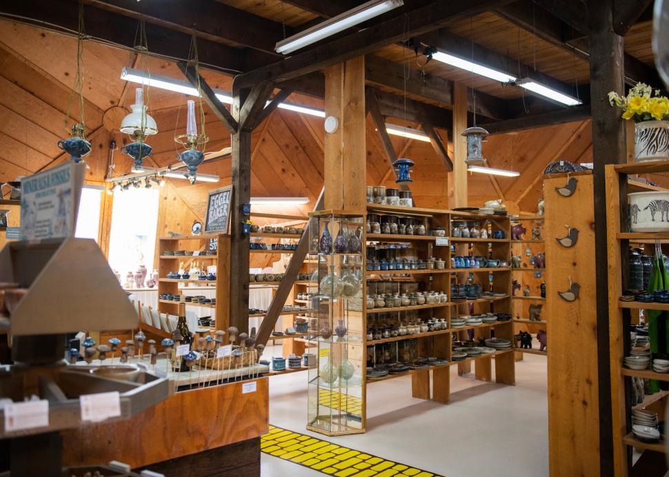 A yellow brick road winds through the shelves inside of the Wizard of Clay Pottery in Bloomfield
