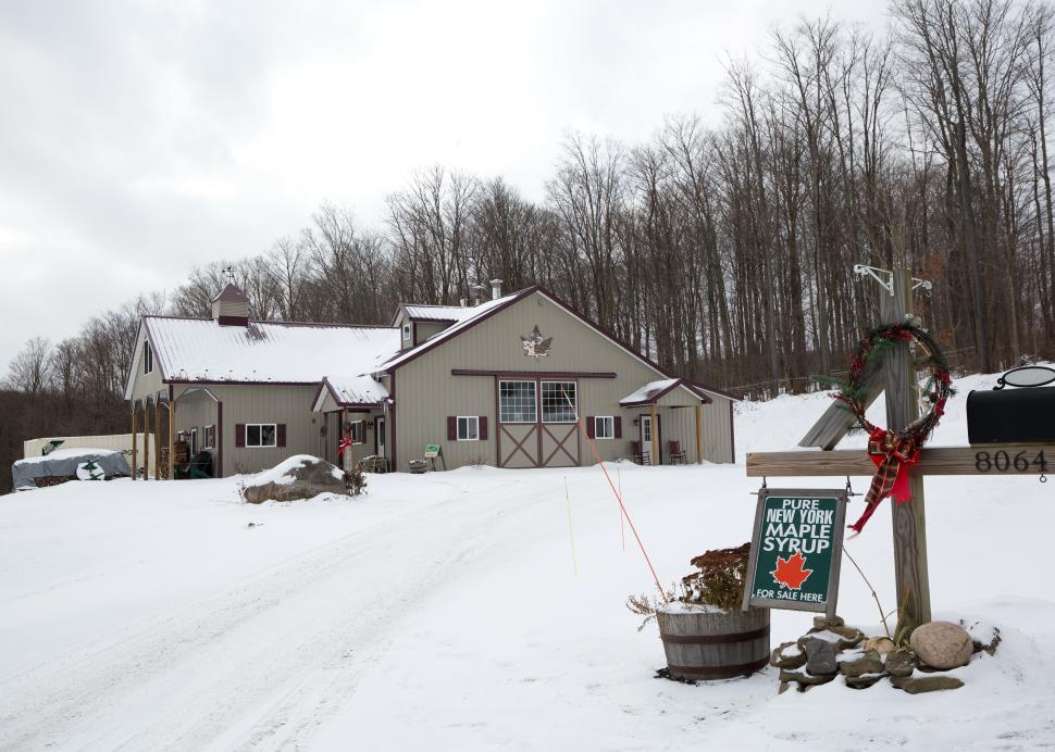 Exterior of the Wohlshlegel's Naples Maple Farm in Naples covered in snow during the winter