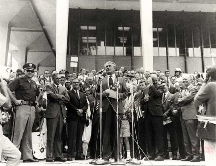 This image is of a news conference on the 1969 Lunar Landing Celebration in front of the Courthouse.