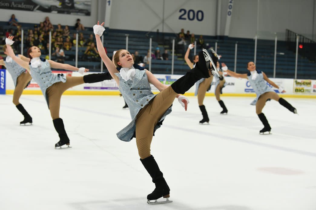 Ice skaters perform in costume to a number during the National Figure Skating on Ice Competition