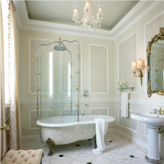 White bathroom with a claw foot bathtub