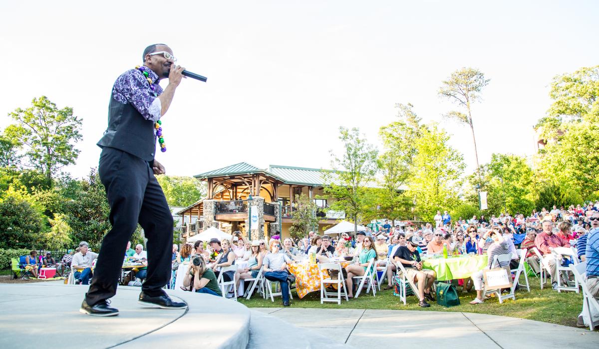 Singer on stage at the Heritage Sandy Springs outdoor concert series, Concerts by the Springs.