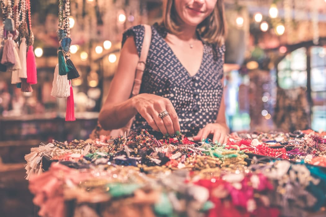 A woman shopping for bracelets
