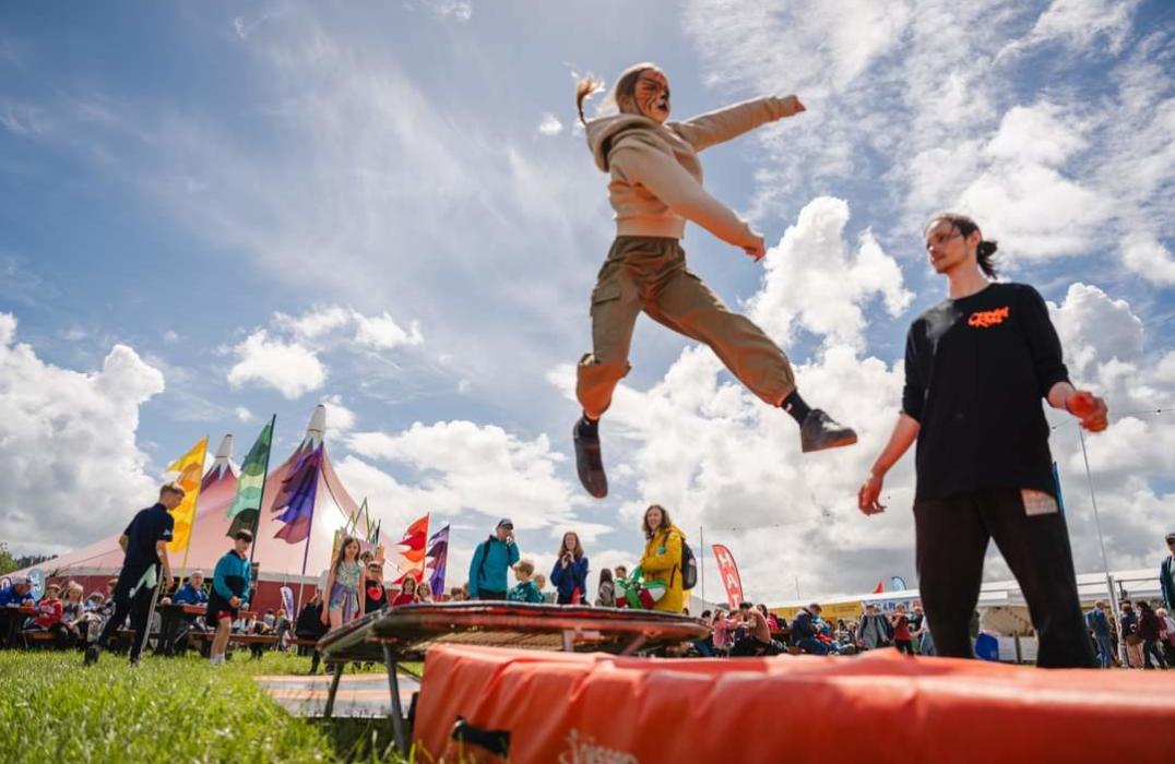 A dancer hanging on a rope