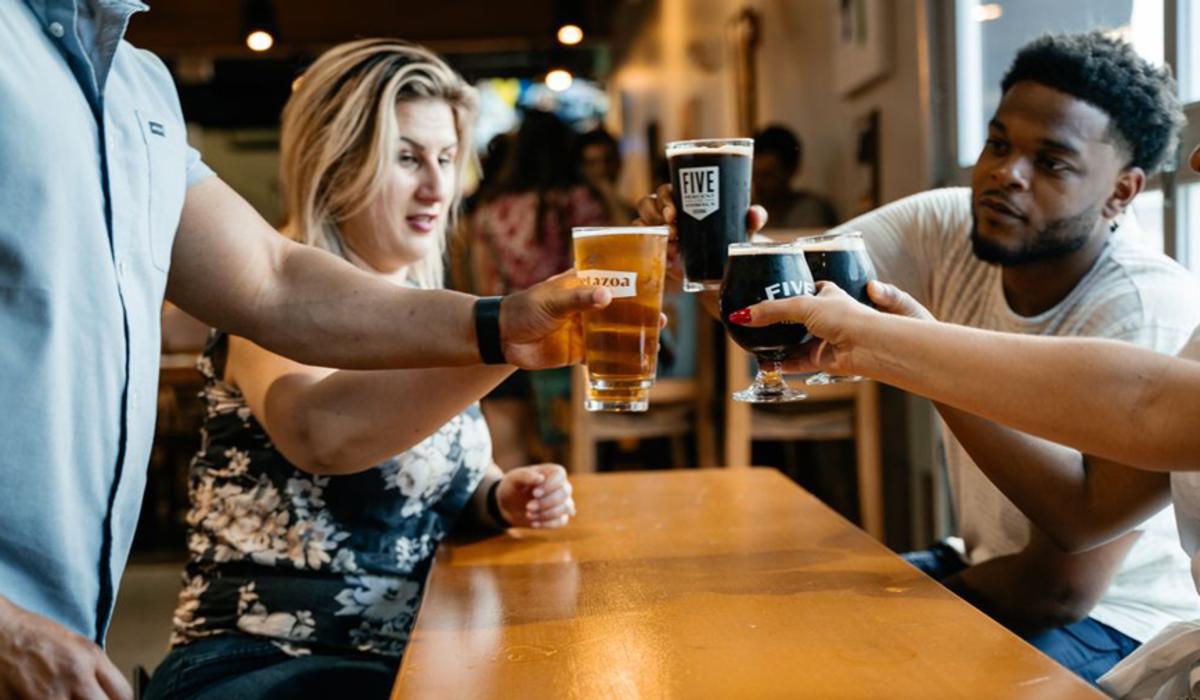 a group of people drinking beer at Metazoa