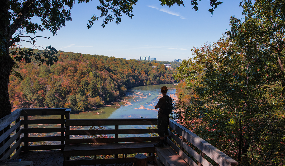 Person on the East Palisades Overlook with the Chattahoochee River in the distance