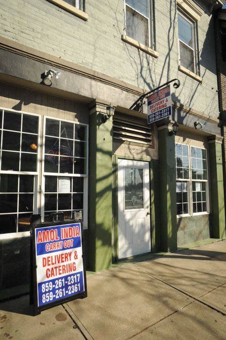 A brick building that houses Amol India restaurant in Newport Kentucky