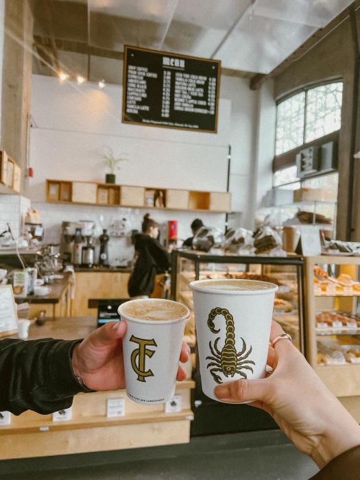 Cindycheeks enjoying coffee and vegan pastries at Timeless Coffee