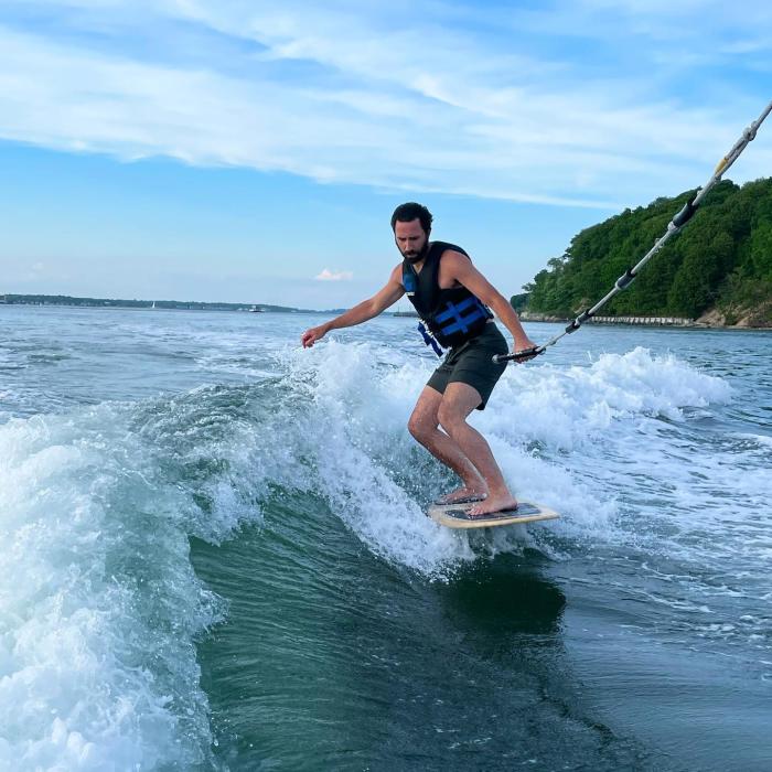 A person wake surfing 