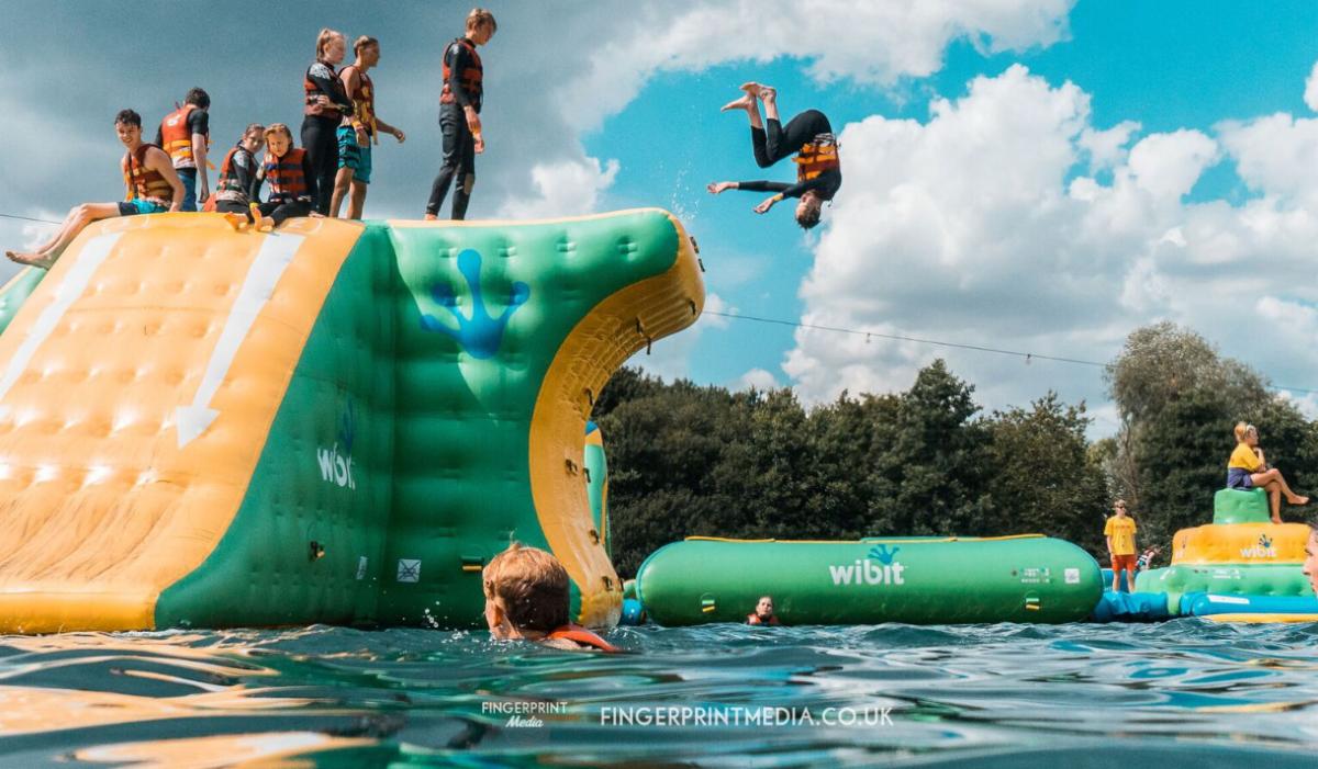 Jumping off inflatables at New Forest Water Park