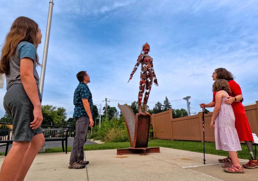 Family admires sculpture at Chelsea Sculpture Walk