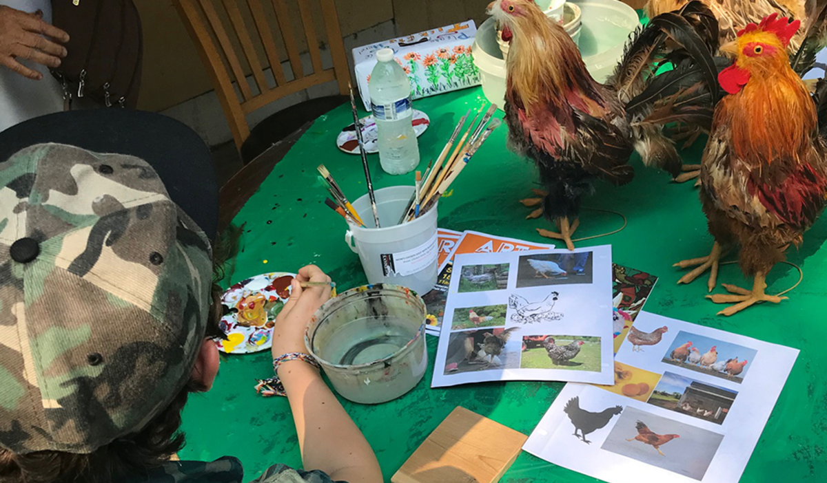 Chicken painting table at Art Barn's Art Blitz 2021