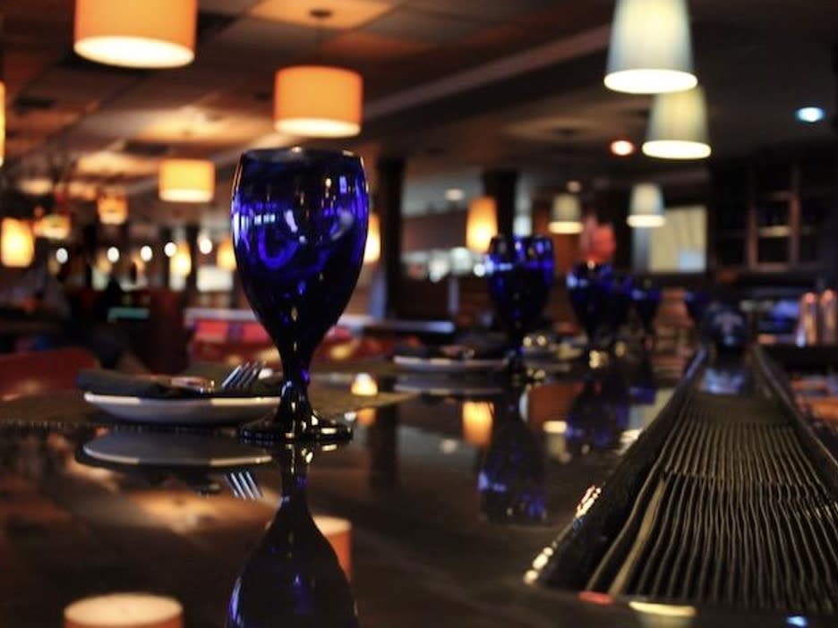 Wine glasses on a bar at the blue point