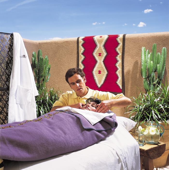 A woman receives a spa treatment at Tamaya Mist Spa & Salon