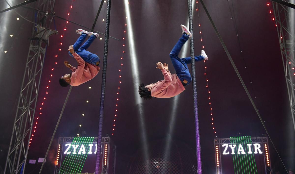 2 Circus performers in the air