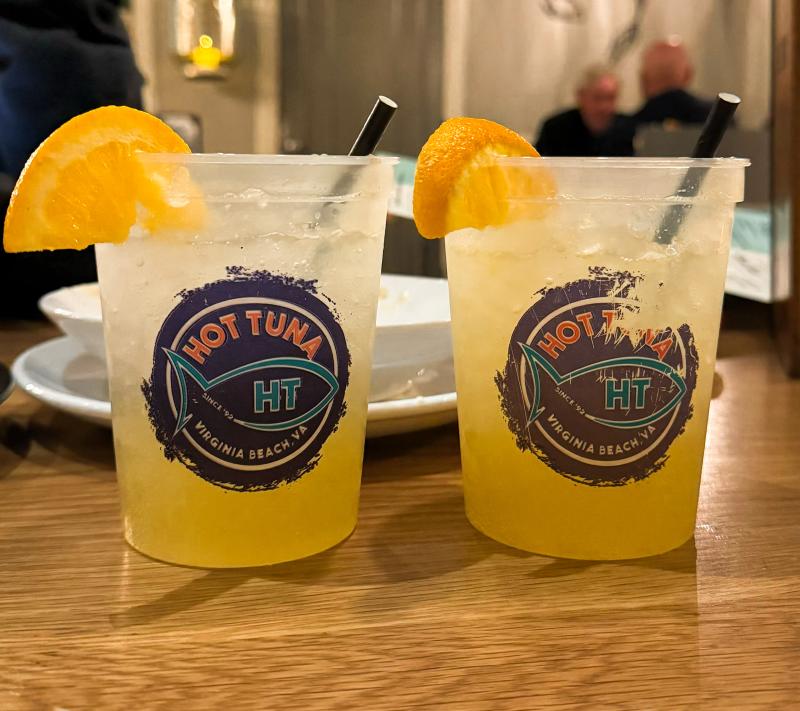 Two orange crush cocktails on a dinner table