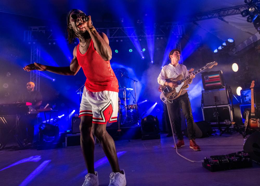 Black Pumas singer and guitarist on stage at Stubb's venue in Austin