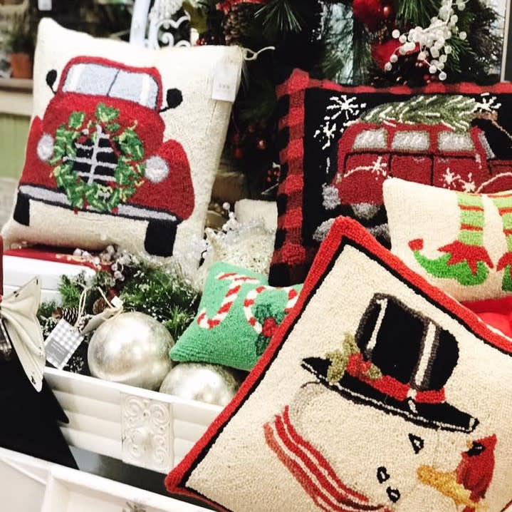 Photo of holiday and Christmas pillows and decorations at Gracie Lane