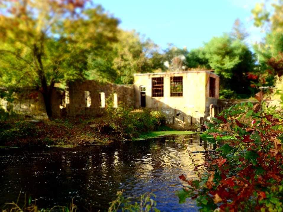 A river with an old building in the background