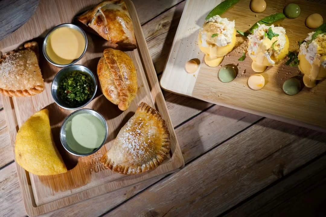 Different Empanadas on a wood cutting board
