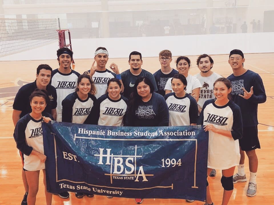 The Hispanic Business Student Association poses after a volleyball game at Texas State University in San Marcos, Texas