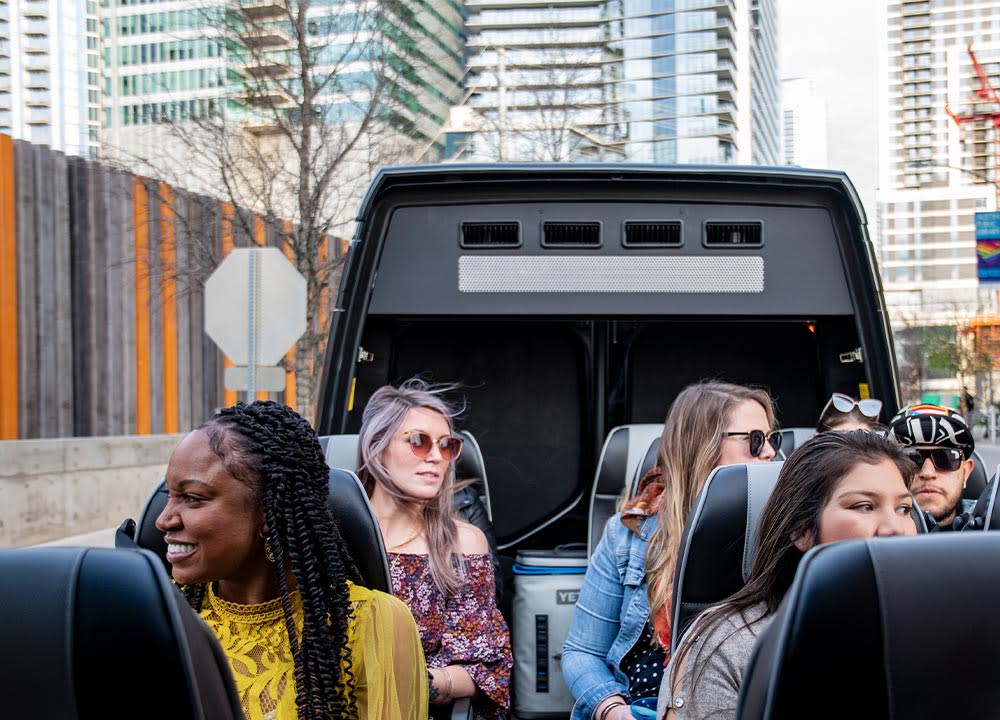 People sitting in open top van on an AO Tour in Austin Texas