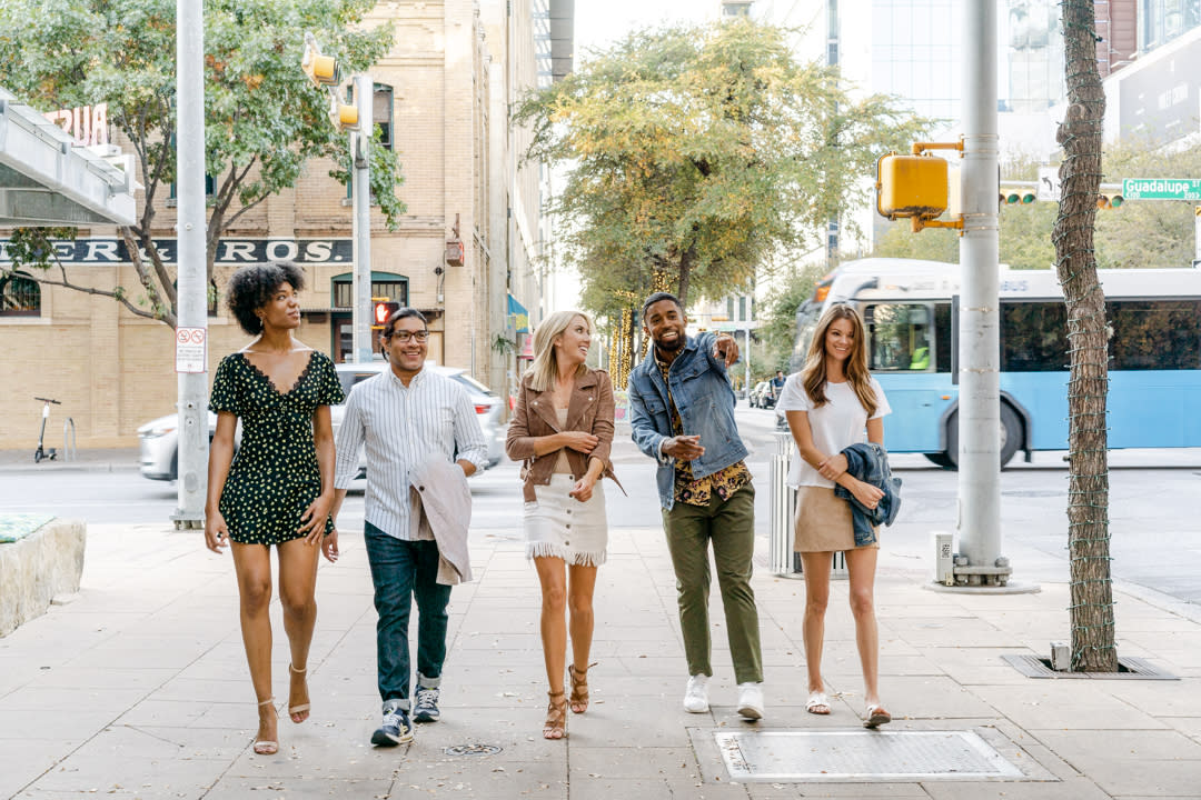 Group of friends walking through 2ND Street District in downtown Austin Texas