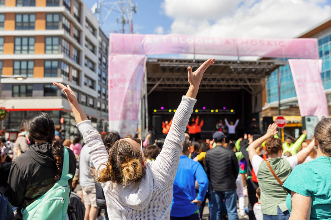 Live performance at Mosaic with a crowd.