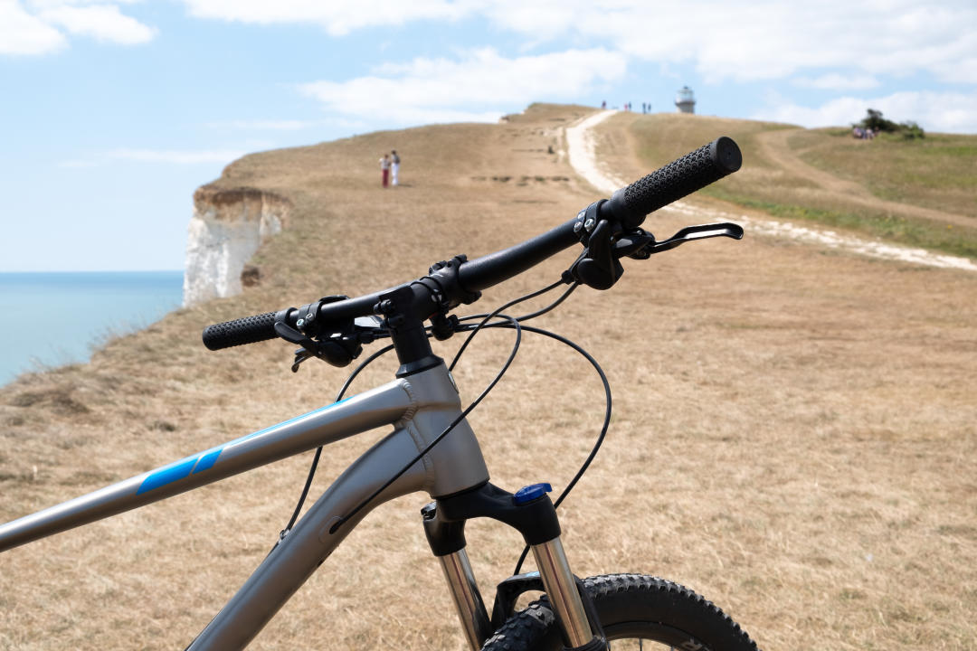 mountain bike with cliffs in the background