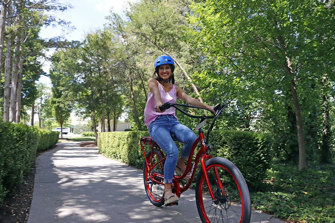 Miss Kansas rides an electric bike from Pedego bikes in Wichita