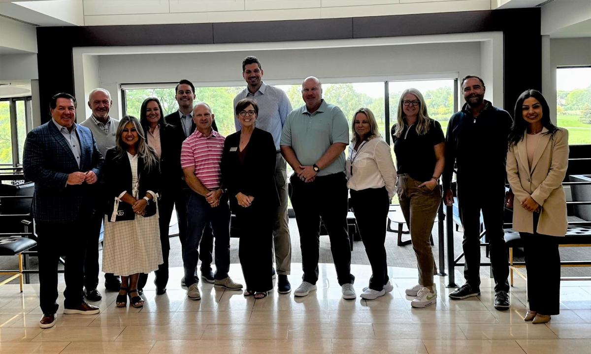 Group of adults on sports site visit